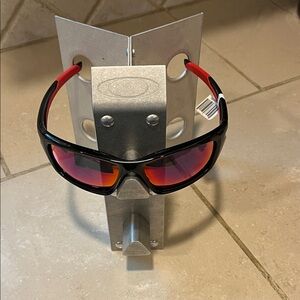 New in Box Oakley Valve Polished Black Frame Sunglasses with Red Iridium Lens